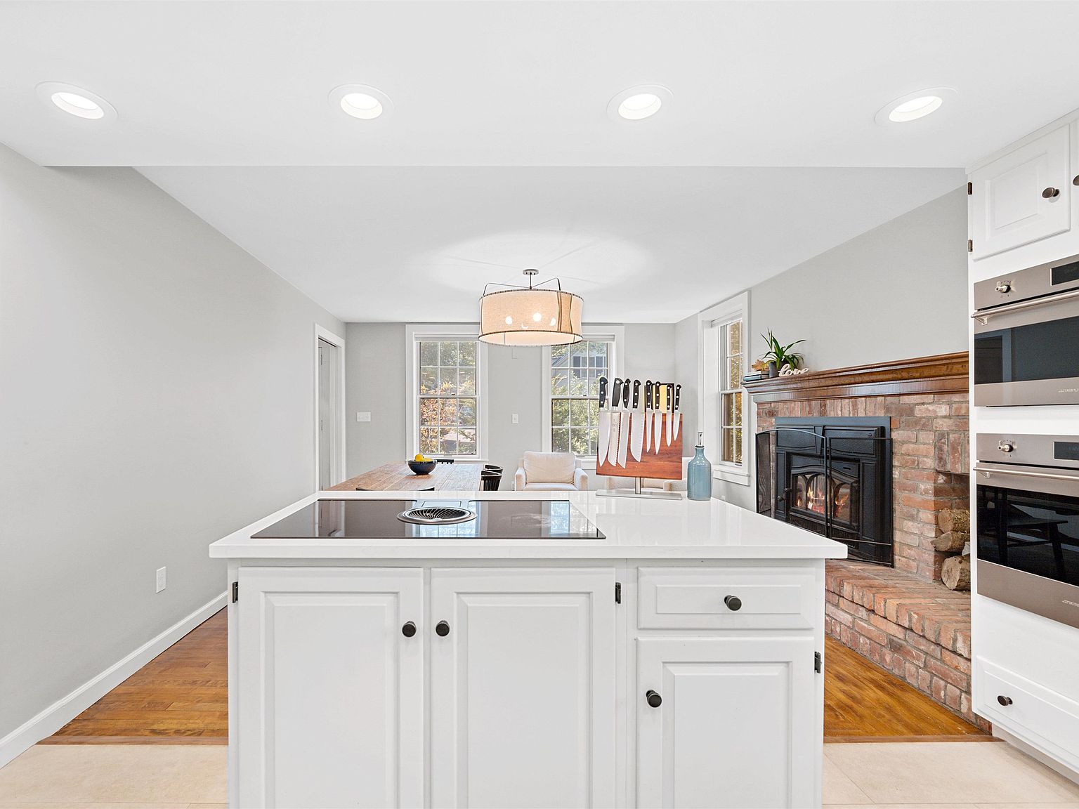 Kitchen with brick fireplace and woodstove